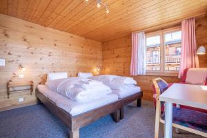 Postel nebo postele na pokoji v ubytování Chalet Weisshorn 3