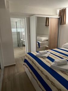 a bedroom with a bed with towels on it at Tisno Resort in Tisno +92 photos