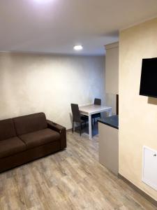 a living room with a couch and a table at El Rocol in Vezza dʼOglio