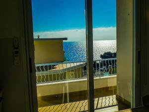 a view of the ocean from a balcony at Silvia al mare in Diano Marina