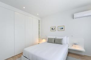 Posteľ alebo postele v izbe v ubytovaní Sé Apartamentos - Casa da Boavista