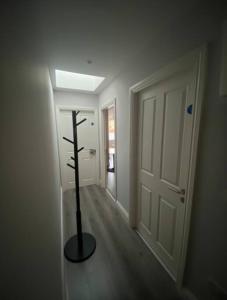a room with a cross on the floor next to a door at Modern and Cosy 1-Bed Apt in the Heart of Dublin in Dublin