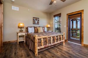 a bedroom with a wooden bed in a room at Staycation Lodge with Indoor Pool and Basketball Court in Branson +57 photos