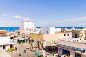 an overview of a city with the ocean in the background at MADREPERLA - SAN FOCA in San Foca +20 photos