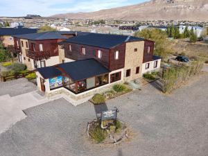 an aerial view of a house with a roof at Hosteria Puerto San Julian in El Calafate