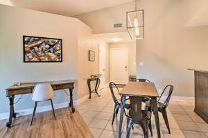 a dining room with a table and chairs in a room at St Pete Condo with Private Lanai and Community Pool! in St Petersburg