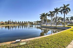 a large pond with palm trees in a park at St Pete Condo with Private Lanai and Community Pool! in St Petersburg