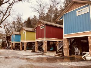 a row of colorful homes in a parking lot at All Seasons Inn in Eureka Springs