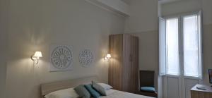 Postel nebo postele na pokoji v ubytování DIAZ Rooms