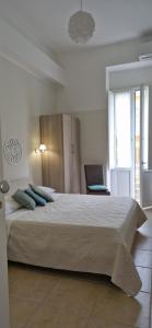 Postel nebo postele na pokoji v ubytování DIAZ Rooms