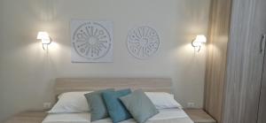 Postel nebo postele na pokoji v ubytování DIAZ Rooms