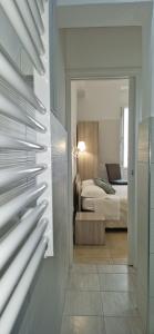Postel nebo postele na pokoji v ubytování DIAZ Rooms