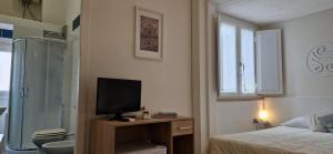 Postel nebo postele na pokoji v ubytování DIAZ Rooms