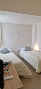 Postel nebo postele na pokoji v ubytování DIAZ Rooms