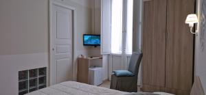 Postel nebo postele na pokoji v ubytování DIAZ Rooms