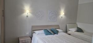 Postel nebo postele na pokoji v ubytování DIAZ Rooms