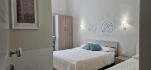 Postel nebo postele na pokoji v ubytování DIAZ Rooms