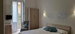 Postel nebo postele na pokoji v ubytování DIAZ Rooms