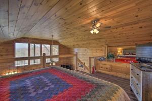 a bedroom with a large bed in a cabin at Gatlinburg Cabin with Pool Table and Hot Tub! in Gatlinburg
