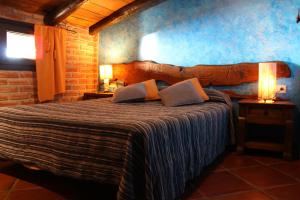En eller flere senge i et værelse på Agroturismo Maddiola