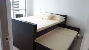 Postel nebo postele na pokoji v ubytování Hermoso apartamento, con la comodidad de tu hogar!