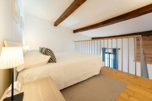 Posteľ alebo postele v izbe v ubytovaní Porcellana Apartment