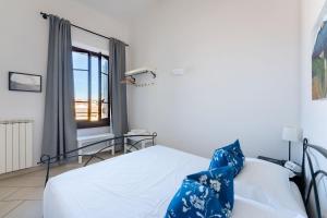 Posteľ alebo postele v izbe v ubytovaní Porcellana Apartment