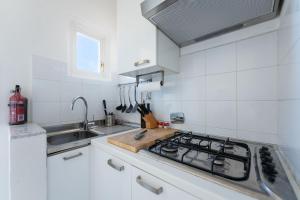 Kuchyňa alebo kuchynka v ubytovaní Porcellana Apartment