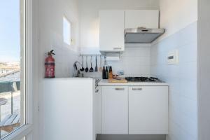 Kuchyňa alebo kuchynka v ubytovaní Porcellana Apartment