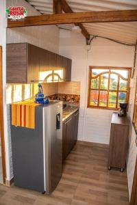 a kitchen with a stainless steel refrigerator in a room at Finca Agroturística Santa Rosa in Gigante