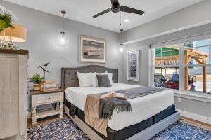 a bedroom with a large bed and a window at Absolutely Shore in Hollister +102 photos