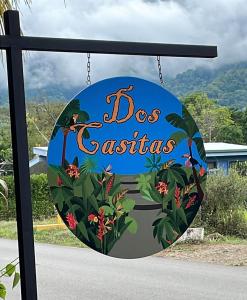 a sign for a dog cafe at Dos Casitas in Ojochal