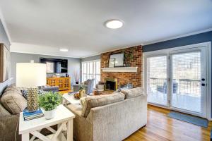 a living room with a couch and a fireplace at Waterfront Florence Home with Private Dock! in Florence