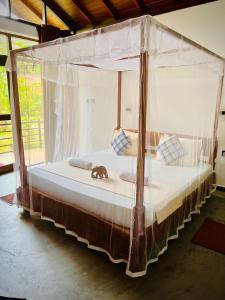 Letto o letti in una camera di Mango Tree House