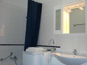 a bathroom with a sink and a toilet and a mirror at ACCI Cannes Les Yuccas in Cannes +19 photos