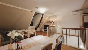 a dining room with a table and some chairs at Elegance Apartment in Vienna