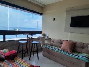 Et opholdsområde på Apartamento na Barra farol da barra salvador bahia vista ao mar