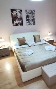 Postel nebo postele na pokoji v ubytování La Terrazza Di Athena sweet rooms