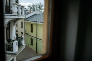 a view of a balcony from a window at Corner Pokoje in Zamość