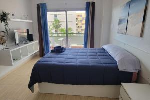 Postel nebo postele na pokoji v ubytování Comodoro Los Cristianos 302T