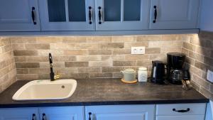 A kitchen or kitchenette at Cozy Corfiot house