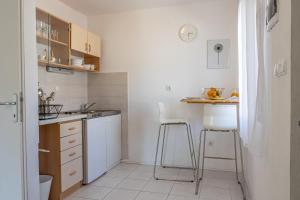 Kuchyň nebo kuchyňský kout v ubytování Apartments Iskra
