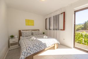 Postel nebo postele na pokoji v ubytování Apartments Iskra
