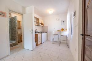 Kuchyň nebo kuchyňský kout v ubytování Apartments Iskra