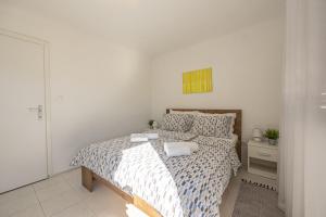 Postel nebo postele na pokoji v ubytování Apartments Iskra