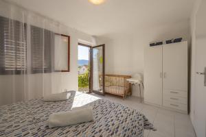 Postel nebo postele na pokoji v ubytování Apartments Iskra