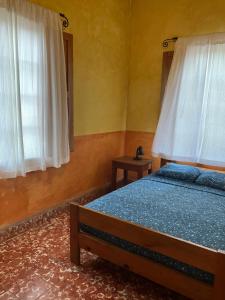 Hostel Iguana Azul tesisinde bir odada yatak veya yataklar