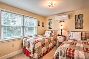 a bedroom with two beds and a window at Central Eugene House with Updated Interior and Yard! in Eugene
