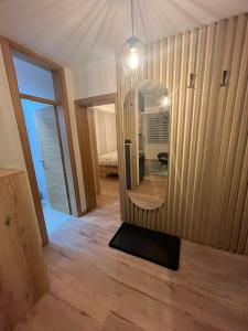 a mirror on a wall in a room at Apartmani NIX VIR in Jahorina