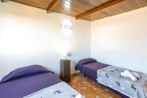 Posteľ alebo postele v izbe v ubytovaní Vivienda Vacacional Folillo